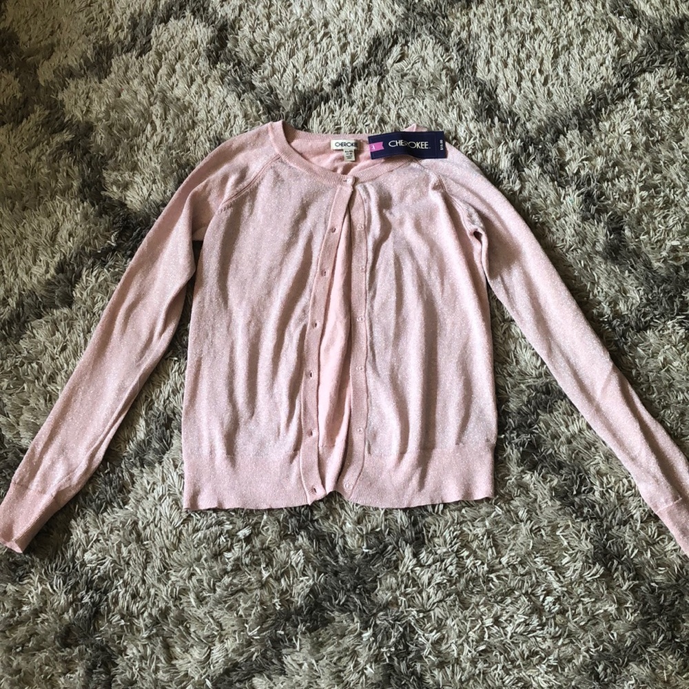 A sparkly pink brand new light formal sweater